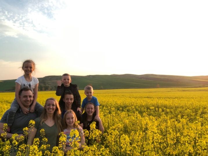 The Hill family visiting a mustard field.