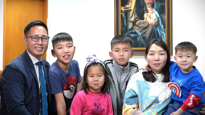Nasanbold Sahkbaatar family photo in a church meetinghouse