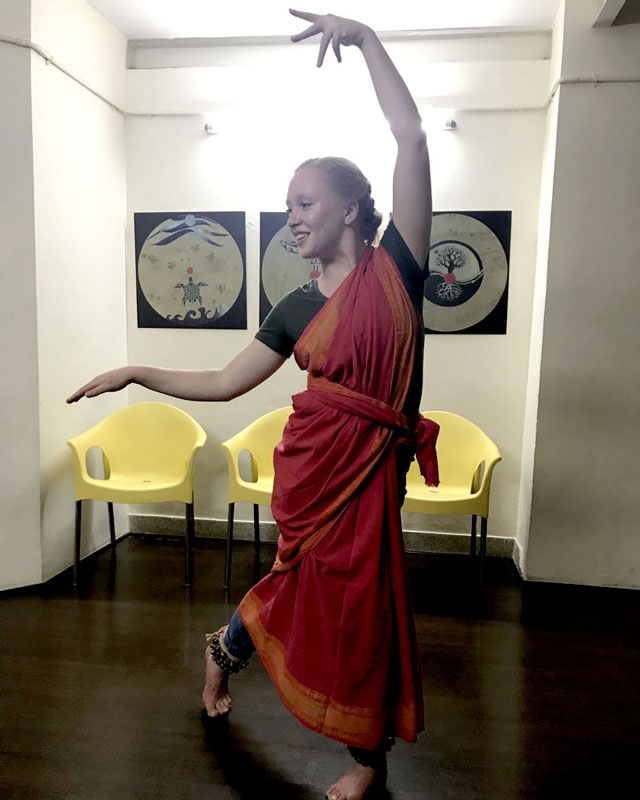 A BYU student learns to dance in classical Indian style during a study abroad in India.
