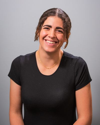 Female BYU student Gabby Sutton smiling in a black shirt