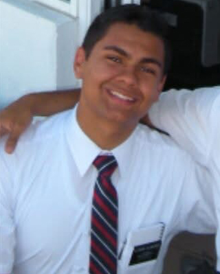 Alejandro Alvarez Flores smiling on his mission.