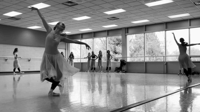 BYU ballet students practice in a sunlit studio.
