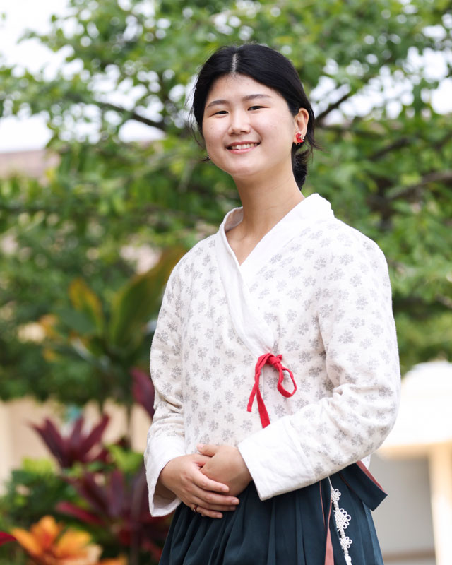 A young Korean woman dressed in a traditional Korean outfit.