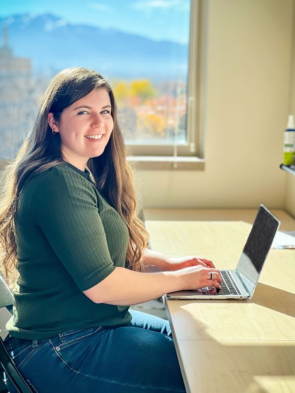 female student smiling with laptop