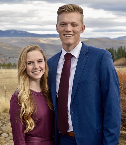 man and woman standing together for a picture