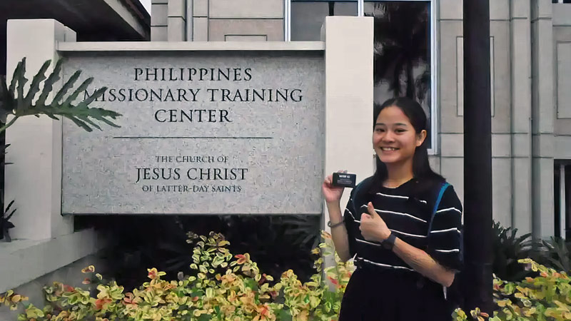 An Vu smiling giving a thumbs up sign as a missionary