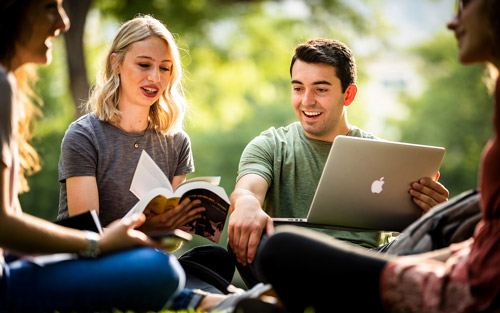 group of BYU students studying outdoors