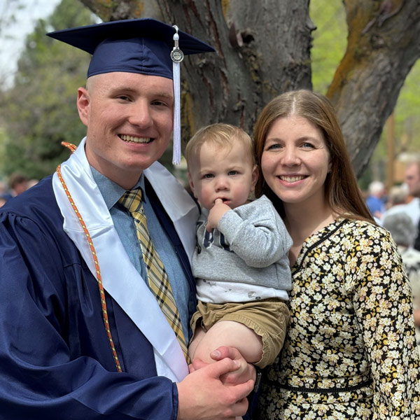 Easton Andersen with his wife and baby during his BYU College of Nursing graduation.  