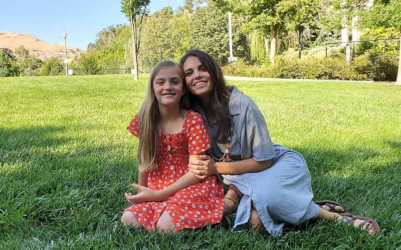 Rachel enjoying a sunny day with her daughter.