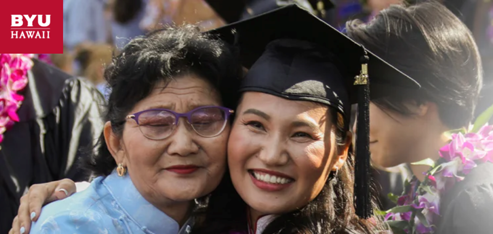 Female BYU-Hawaii graduate hugging her mother