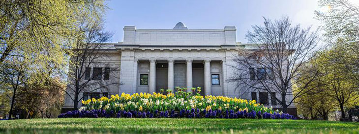BYU building on campus with spring flowers