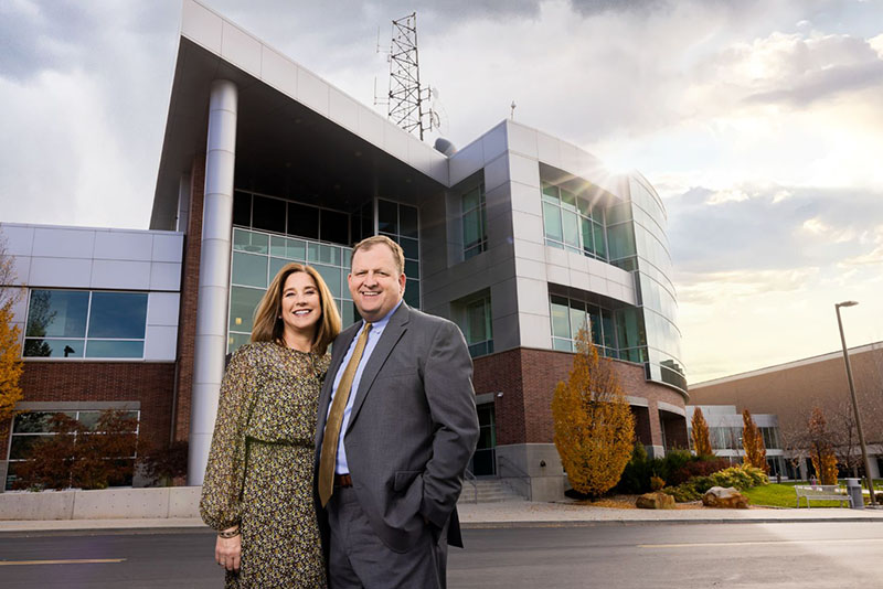 Man and woman in front of building