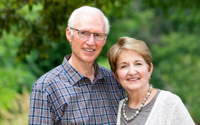 Elderly man and woman smiling