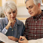 Husband and wife looking at a printed document
