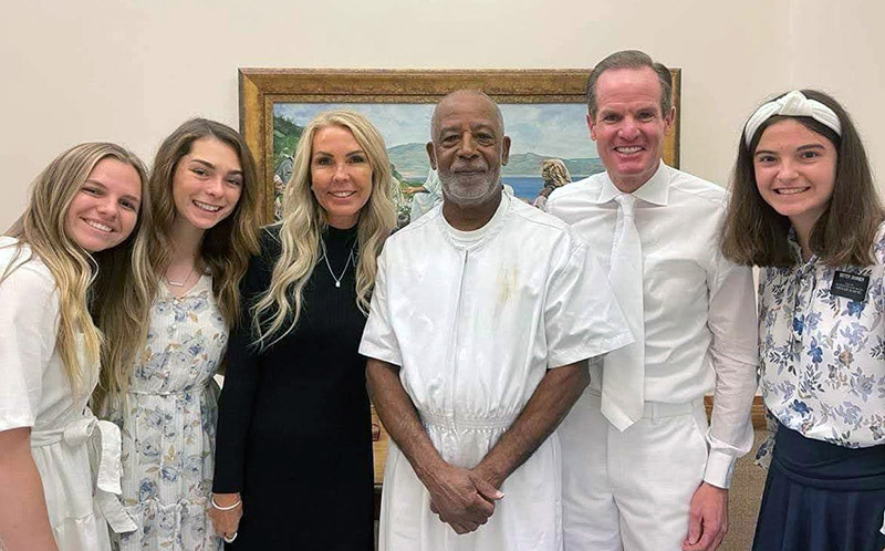 sister missionaries with man ready to be baptized.